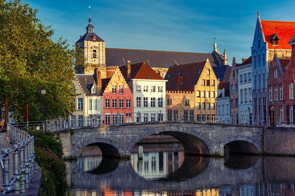 River view of old town with bridge in Bruges, Belgium