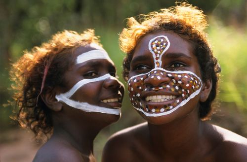 Aboriginal sisters Tessa and Jane Leti painted up with her clan dreaming totems by her father, Dharpi,  Arnhem Land