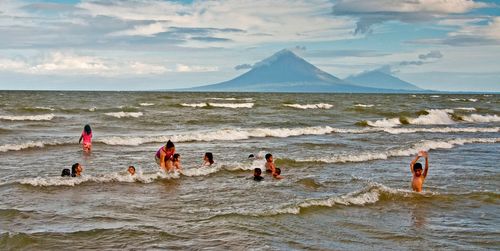 Lake Nicaragua beach north of Rivas with children playing with their teacher, Concepcion and Maderas volcanoes in background. Image shot 01/2009. Exact date unknown.