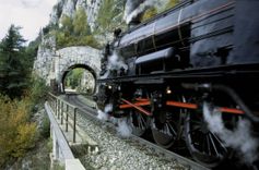 Semmering railway: ancient steamer in front of Krausel tunnel. Semmering, Lower Austria.