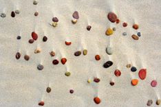 Stones in the sand Baltic Sea, Slowinski National Park in Poland © Pecold/Shutterstock