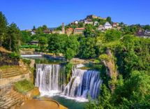 jajce-town-pliva-waterfall-bosnia-herzegovina-shutterstock_568706347