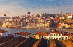 Porto Ribeira, traditional facades, old multi-colored houses with red roof tiles on the embankment in the city of Porto, Portugal