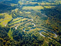 Winding road in Bieszczady mountains photographed from drone © MiloszG/Shutterstock